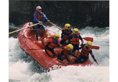 Action shot of Jo Deurbrouck raft guiding on the Lochsa River