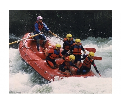 Action shot of Jo Deurbrouck raft guiding on the Lochsa River