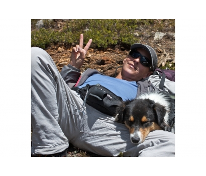 Jo Deurbrouck and her dog Radar take a break from fishing